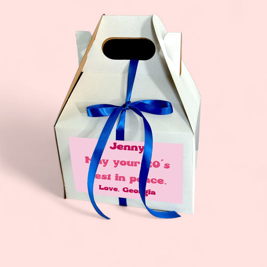 in my thirties era birthday candle gable gift box in a clear jar with gold lid and custom pink nineties retro label